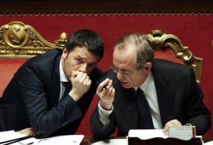 Italy's PM Renzi talks with Finance Minister Padoan during a confidence vote at the Senate in Rome